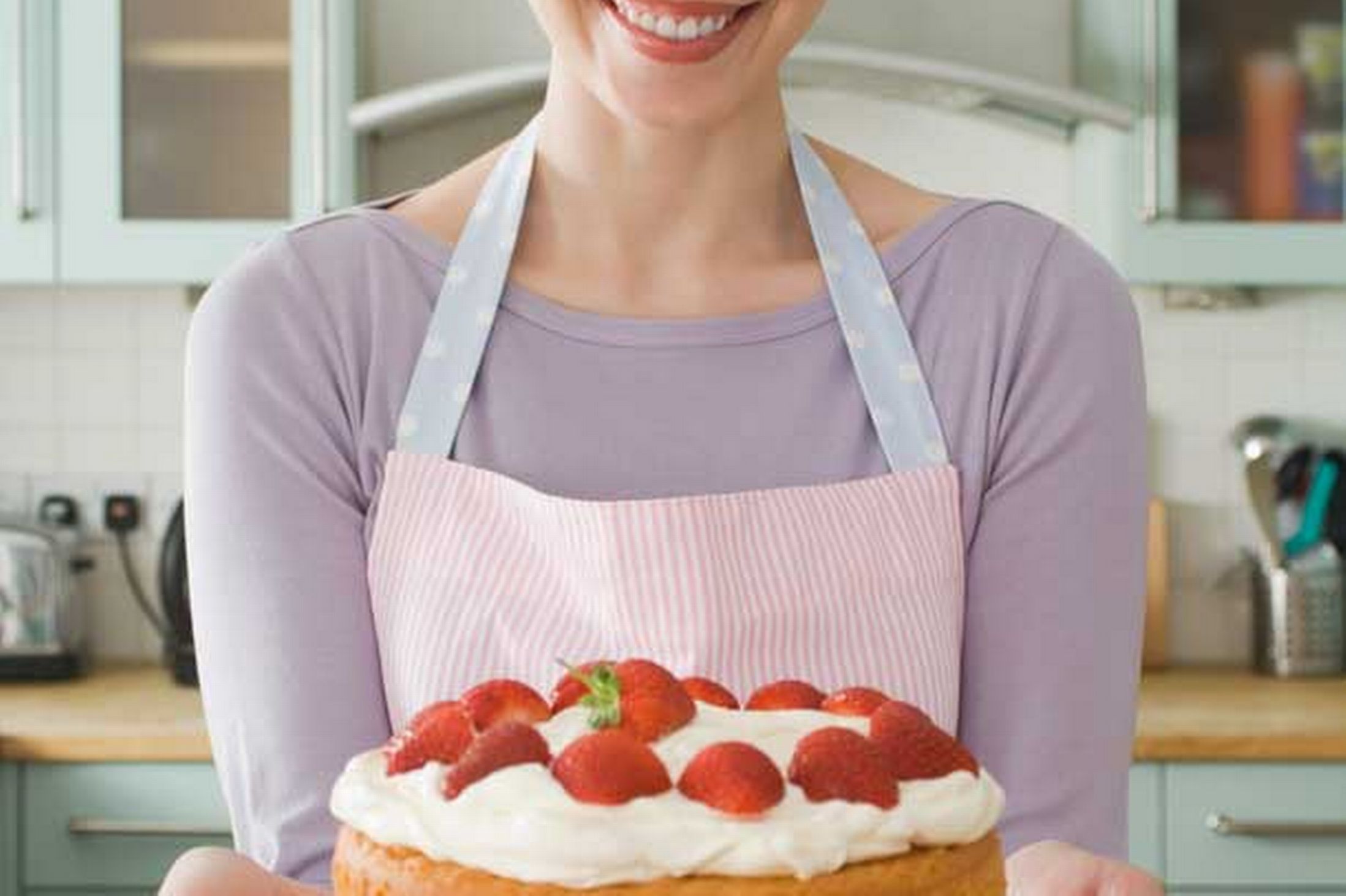 woman-holding-a-cake-pic-getty-images-597720498.jpg