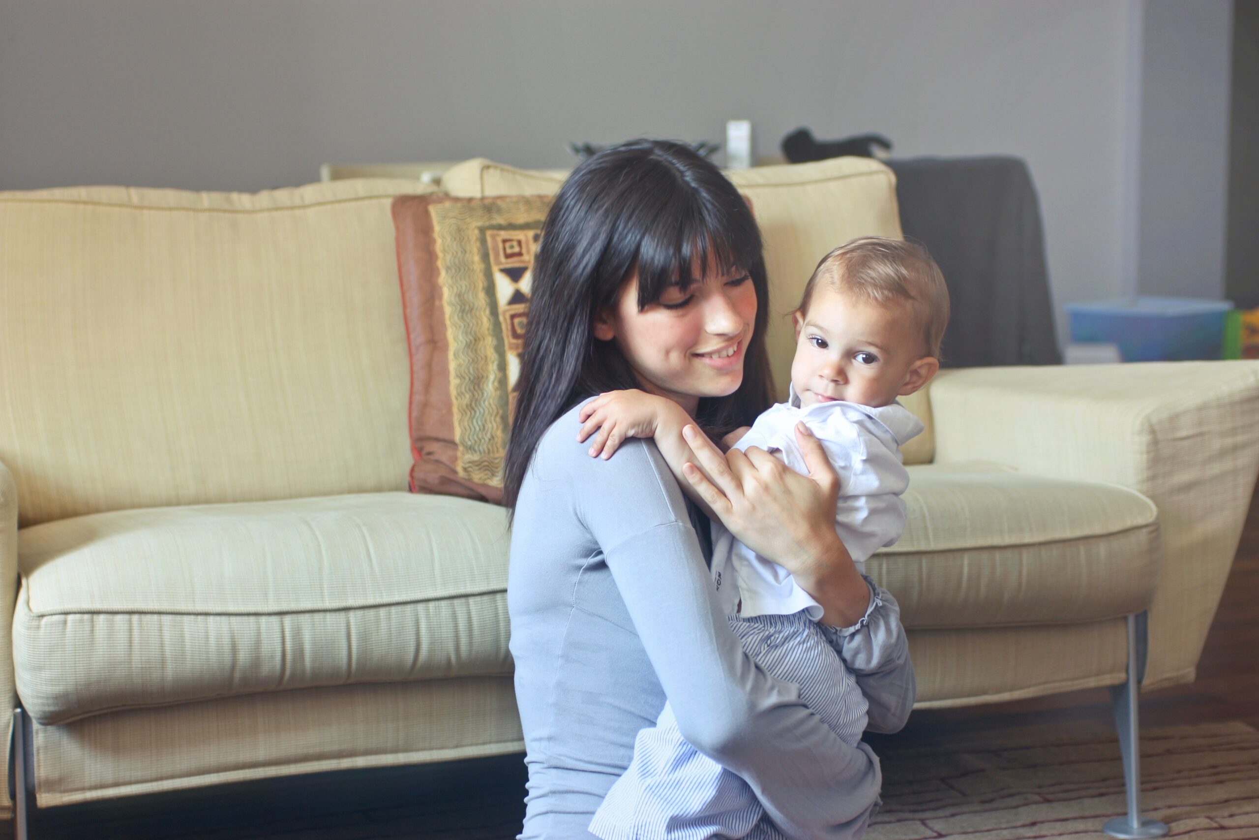woman-in-gray-sweater-carrying-toddler-in-white-button-up-755049.jpg