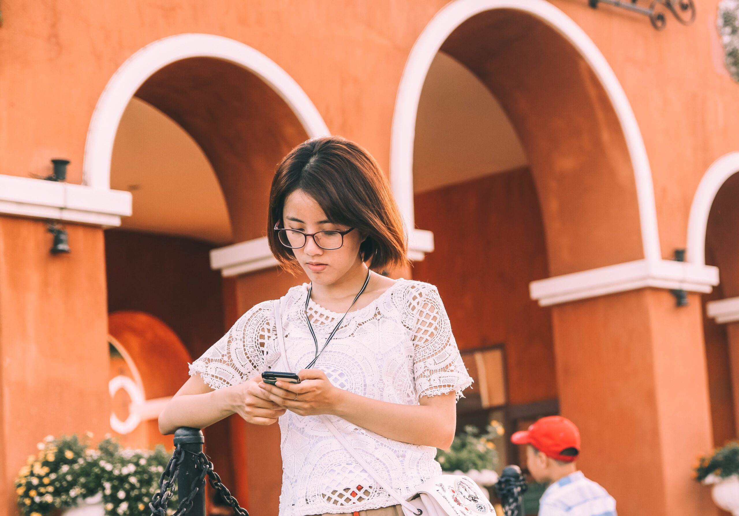woman-using-smartphone-while-walking-2332535.jpg