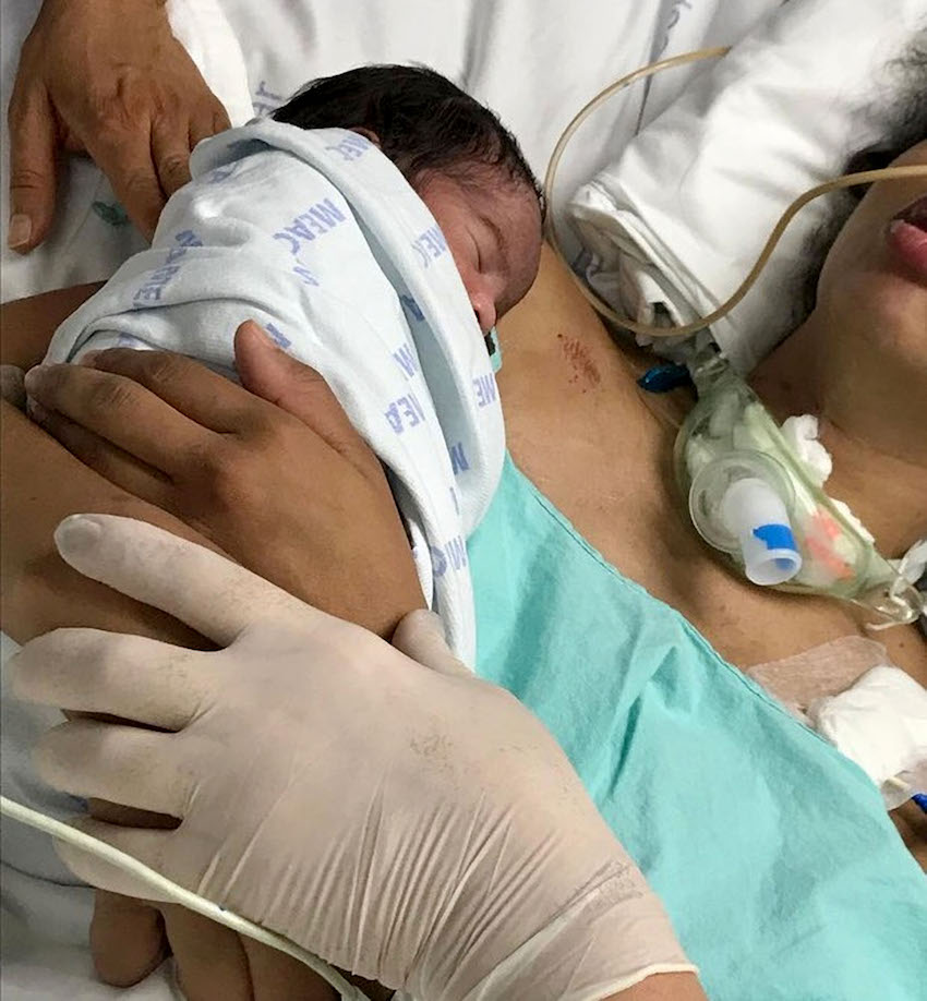 MUM IN COMA GIVES BIRTH