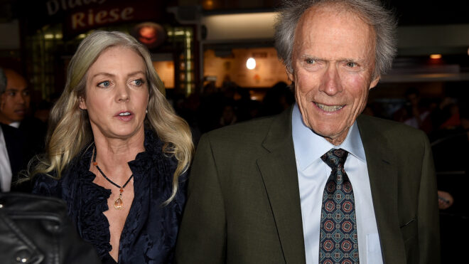 Christina Sandera, left, and Clint Eastwood arrive at the premiere of "The Mule" at the Village Theatre on Dec. 10, 2018, in Los Angeles.