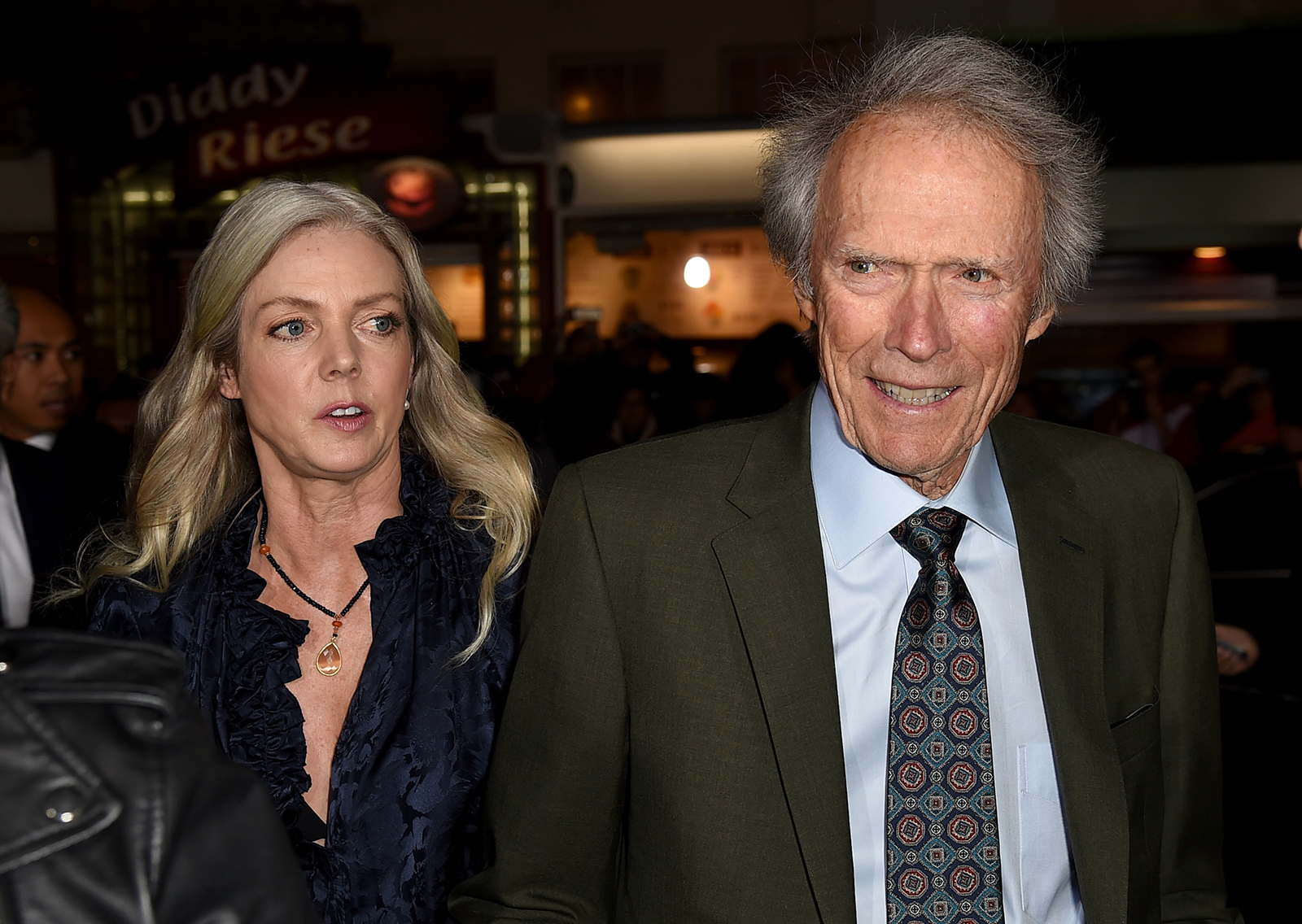 Christina Sandera, left, and Clint Eastwood arrive at the premiere of "The Mule" at the Village Theatre on Dec. 10, 2018, in Los Angeles.