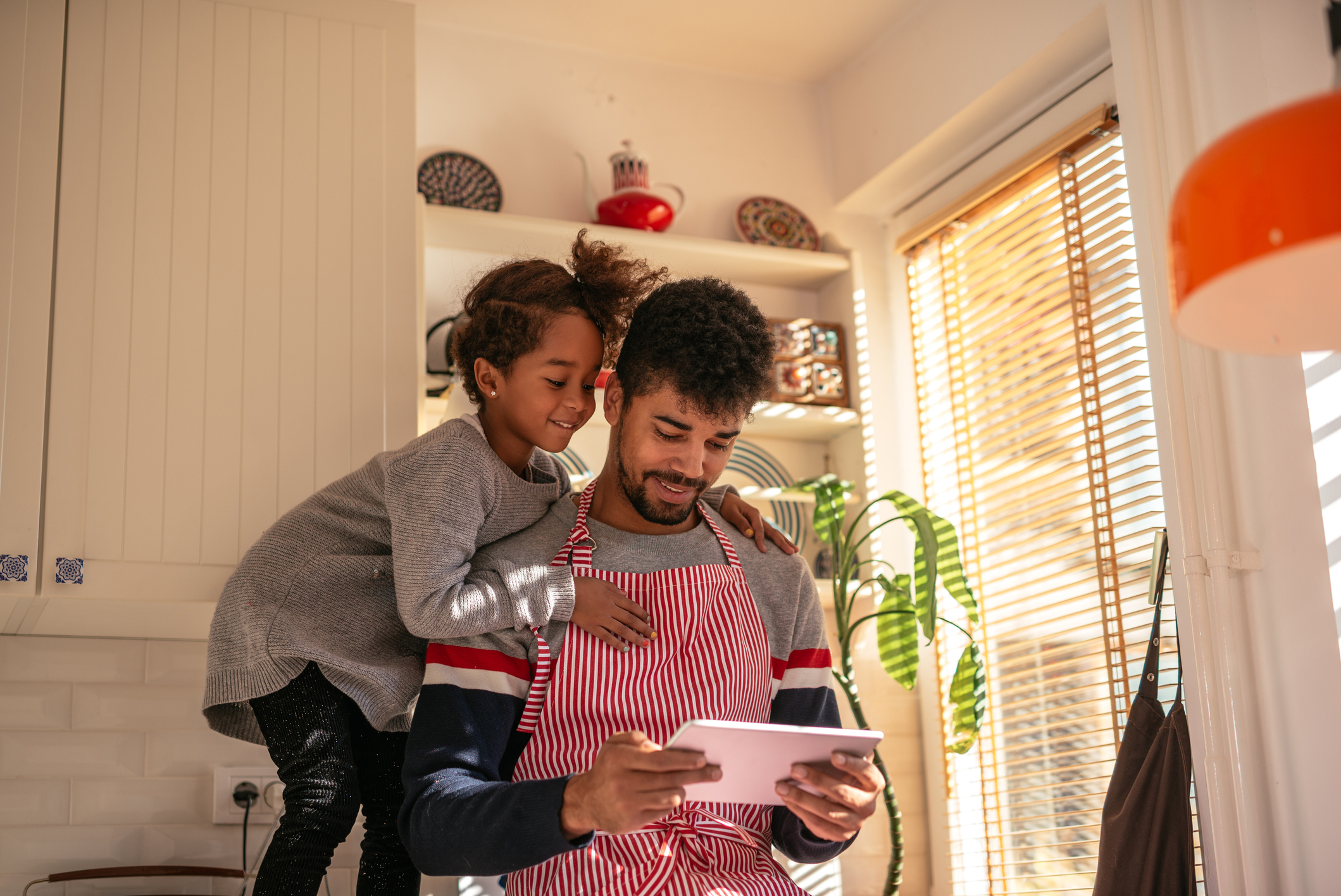 Dad and daughter cooking together