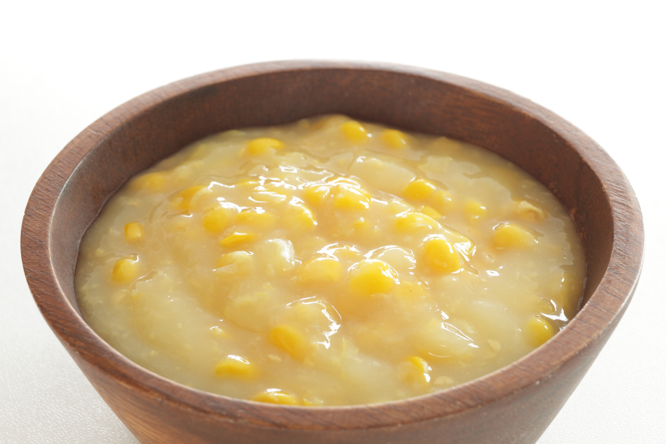 cream sweet corn in wooden bowl