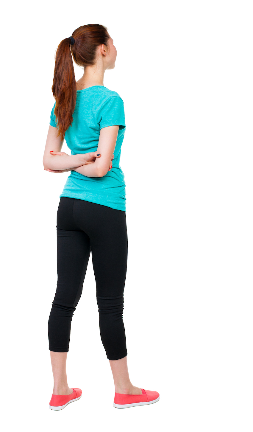 back view of standing young beautiful  woman. girl  watching.