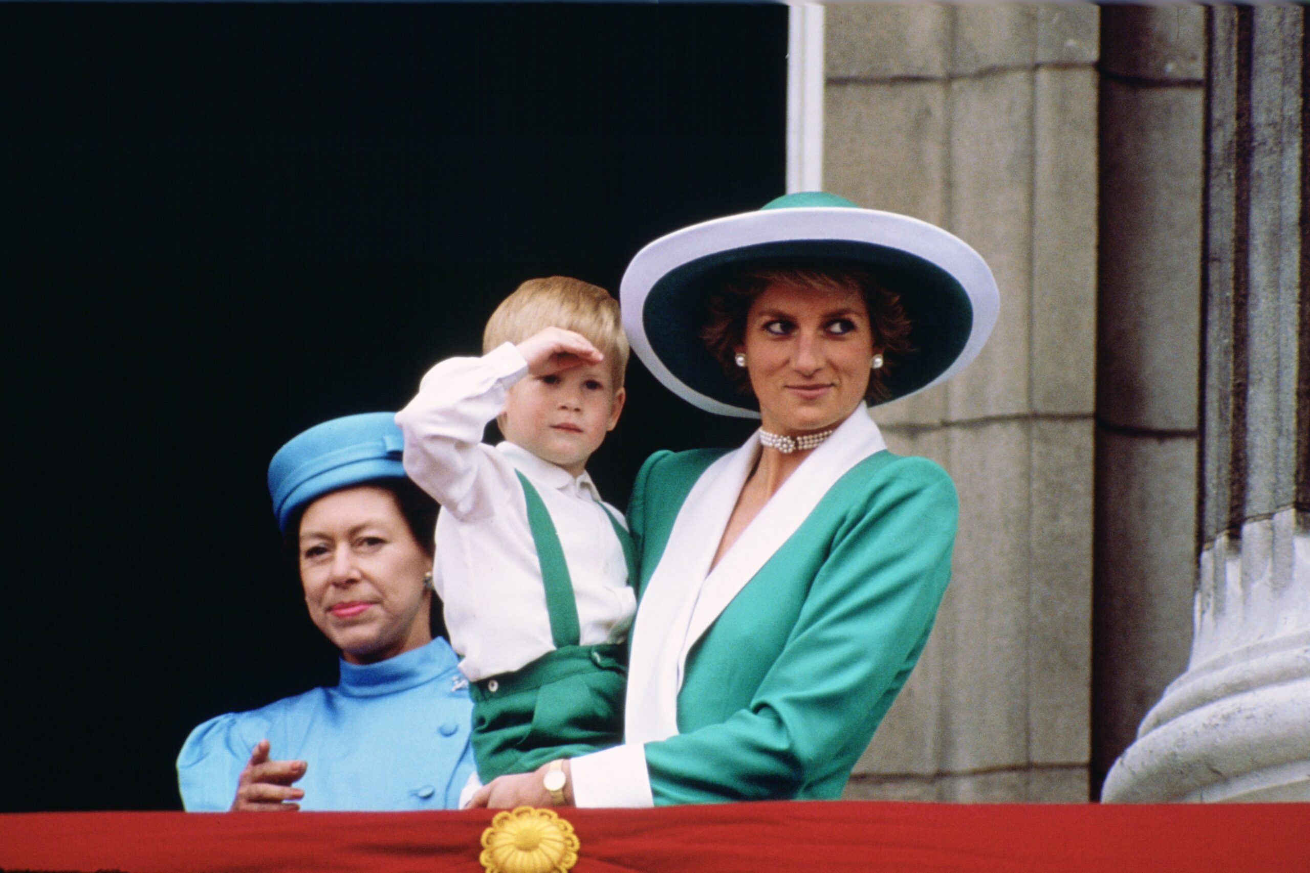 Diana, Princess of Wales, holding a young Prince Harry in he