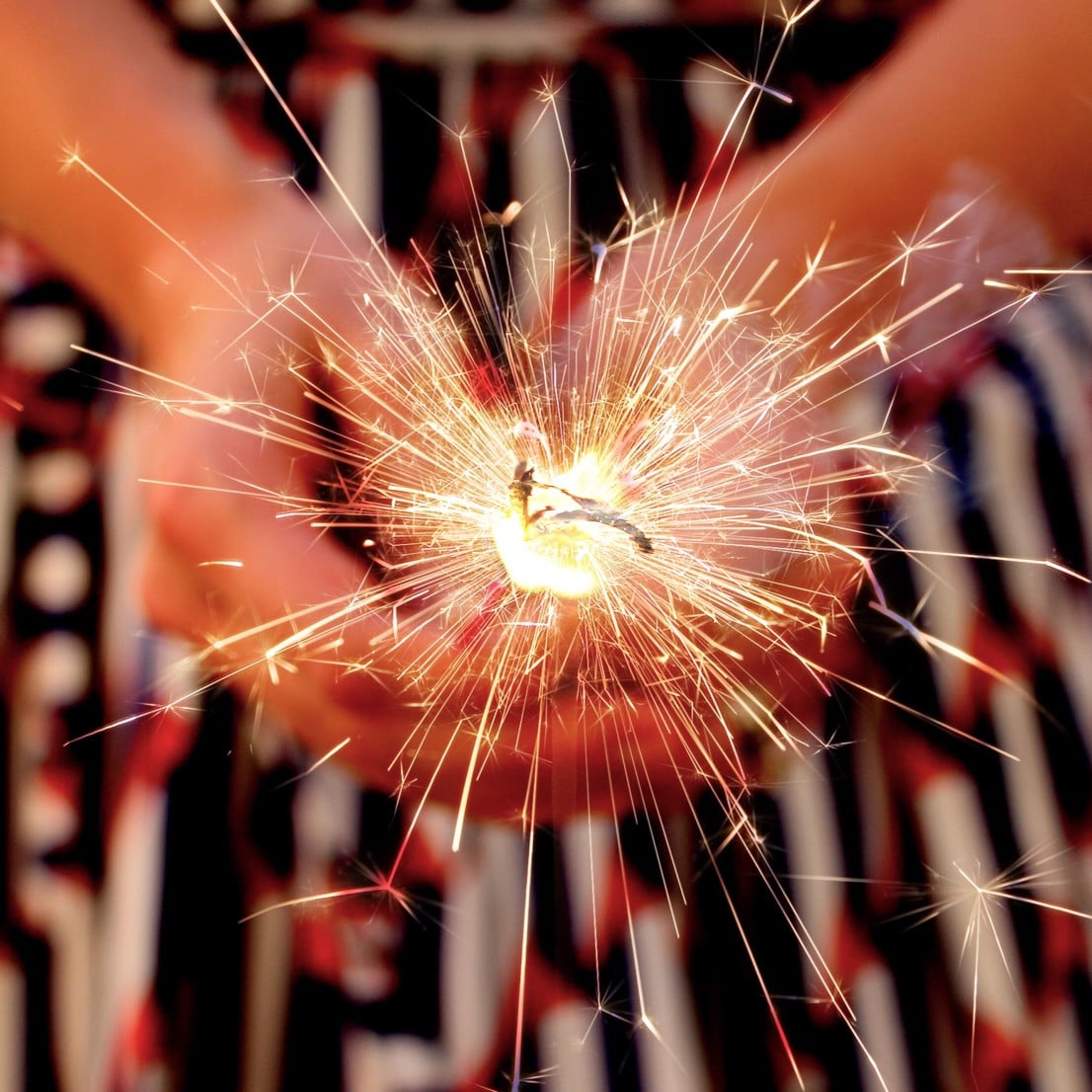 a-woman-holding-a-sparkler-on-4th-of-july_t20_Oxxy1b.jpg