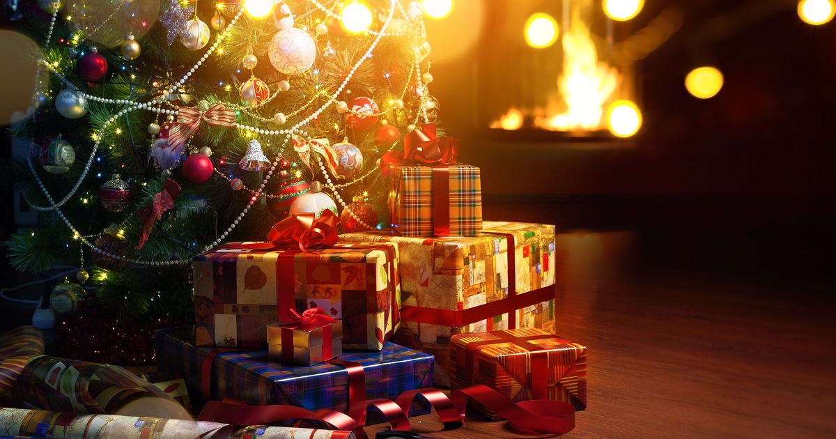 Christmas tree and holidays present on fireplace background