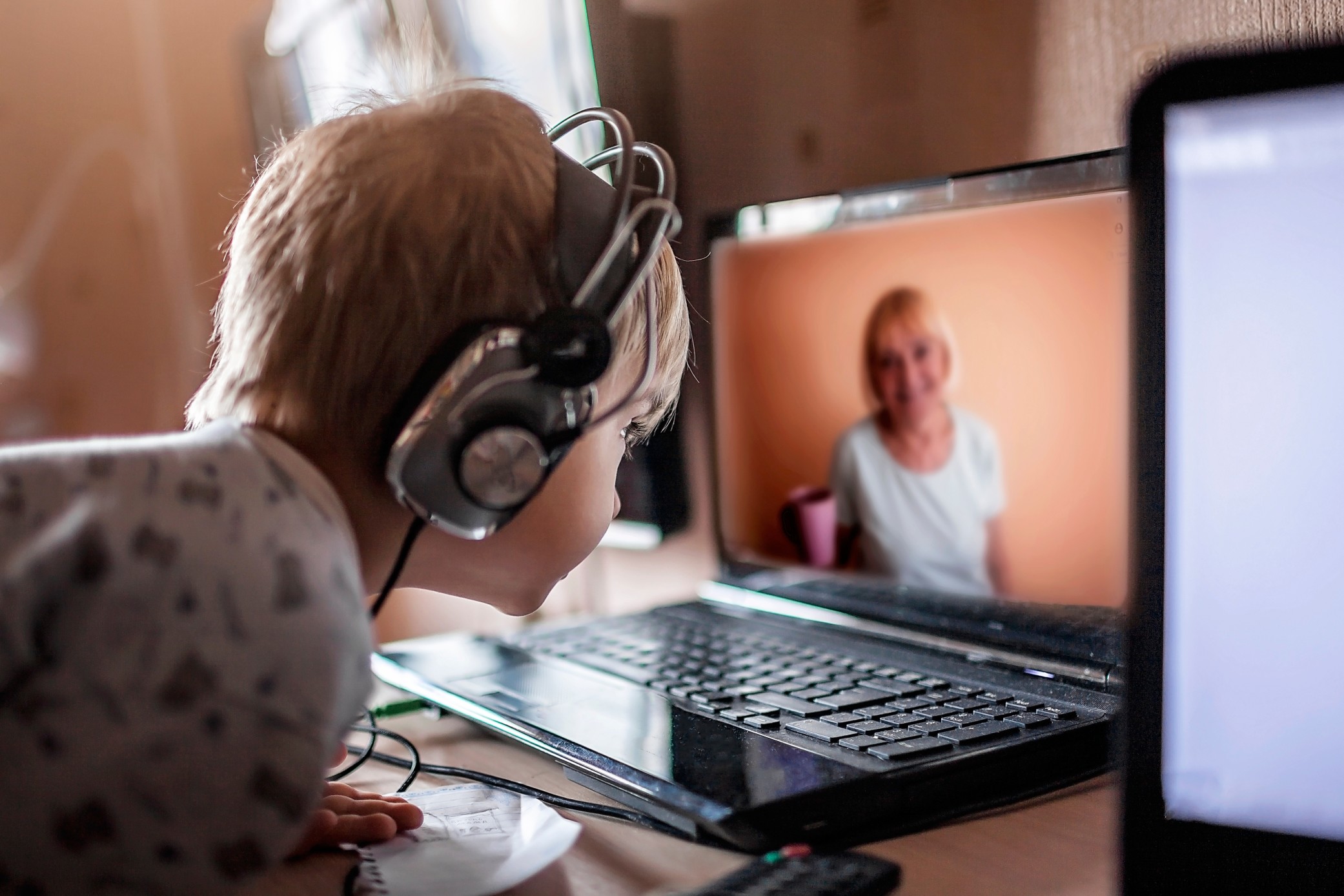 cute-boy-talking-with-his-grandmother-within-video-chat-on-laptop-life-in-quarantine-time-older_t20_WgV6K1.jpg