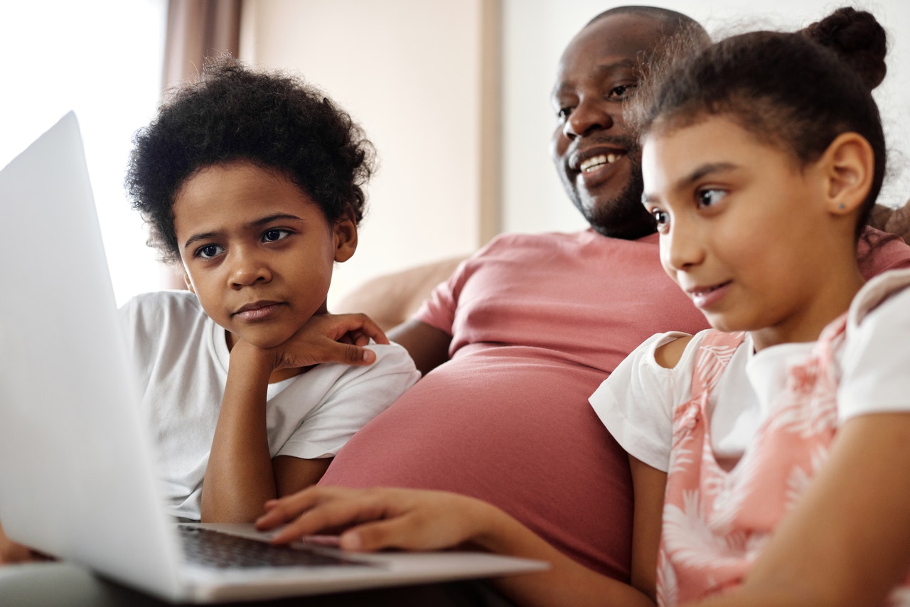 family-looking-at-a-laptop-4260747.jpg