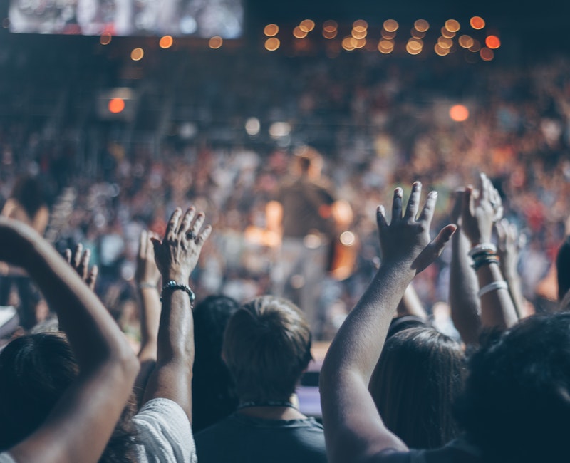 group-of-people-raise-their-hands-on-stadium-976866.jpg