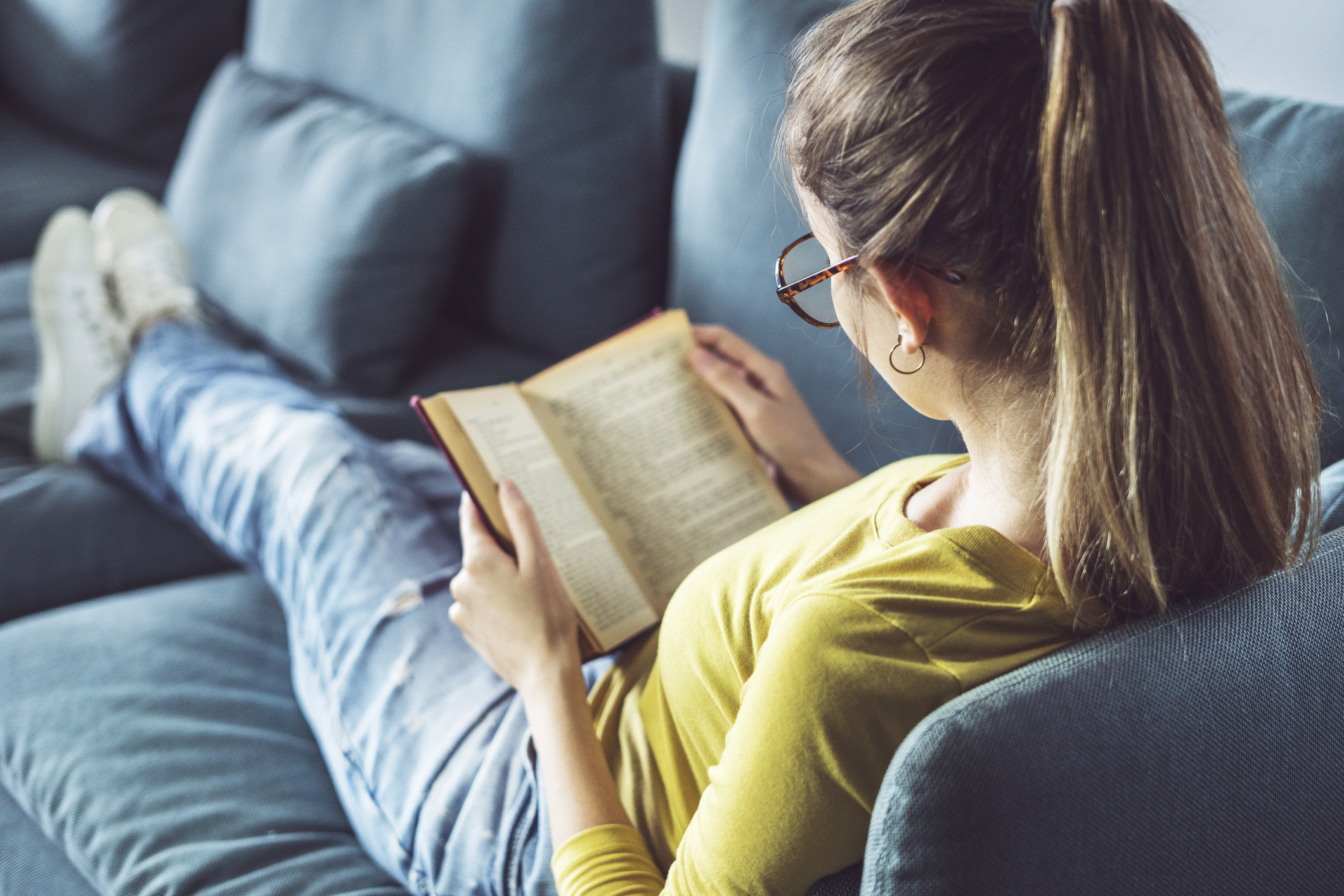 Young woman is reading book