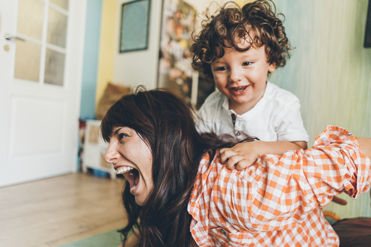 Mother and son having fun at home