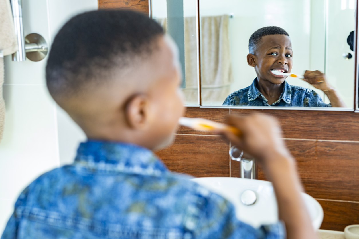 Young African Boy Brushing His Teeth