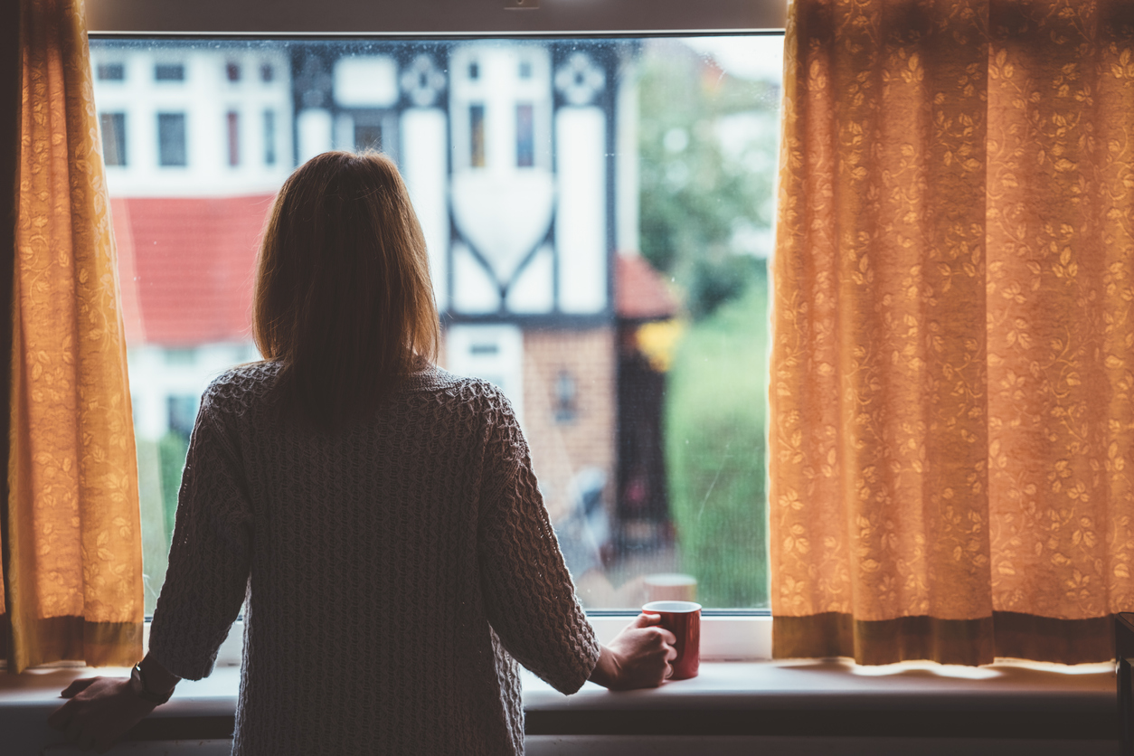 Woman drinking tea at home