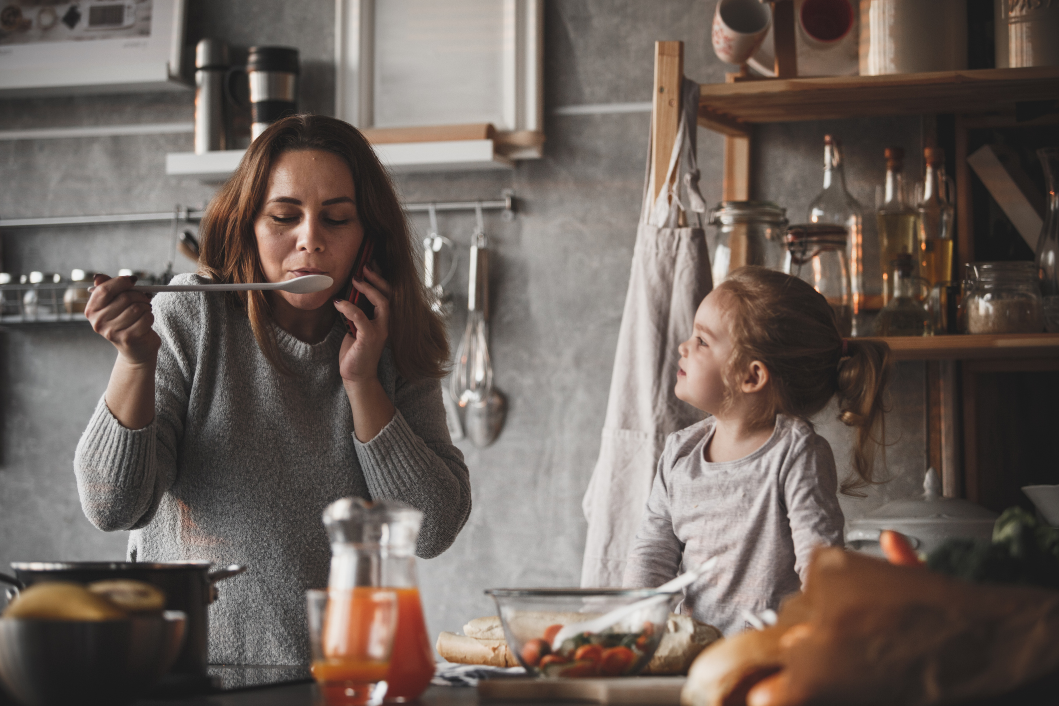 Mother on the phone, cooking