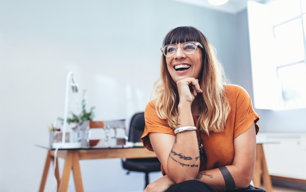 Portrait of a smiling businesswoman sitting in office