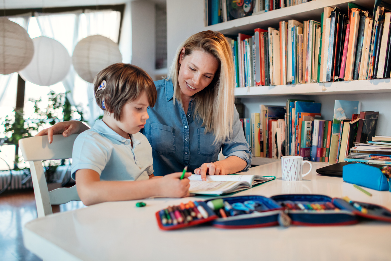 Mother And Her Son Doing Homework