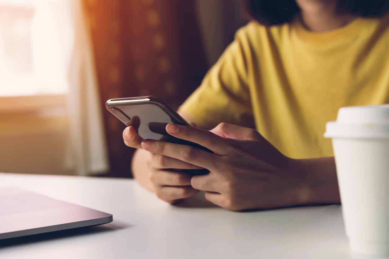 woman holding smartphone,  using cell phone on cafe. Technology for communication concept.