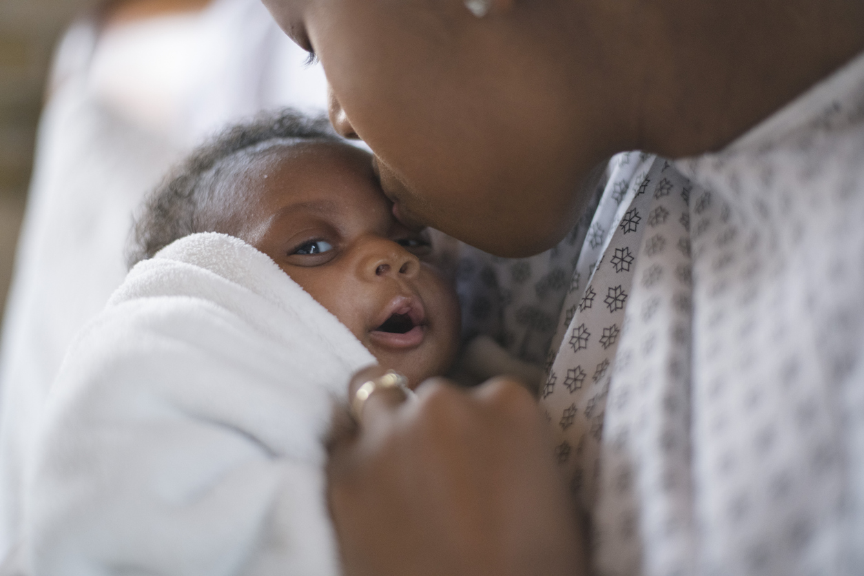 A newborn and mother in a hospital