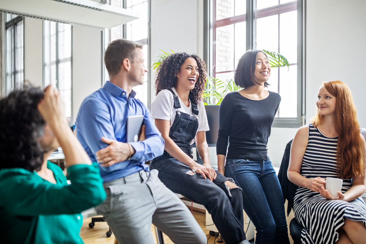 Professionals laughing in a meeting