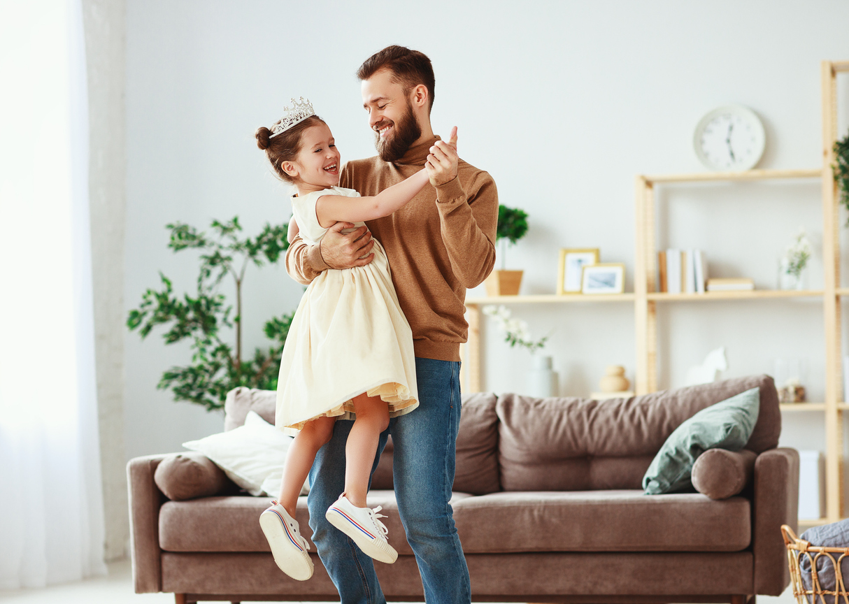 Happy father's day! family dad and child daughter Princess dancing