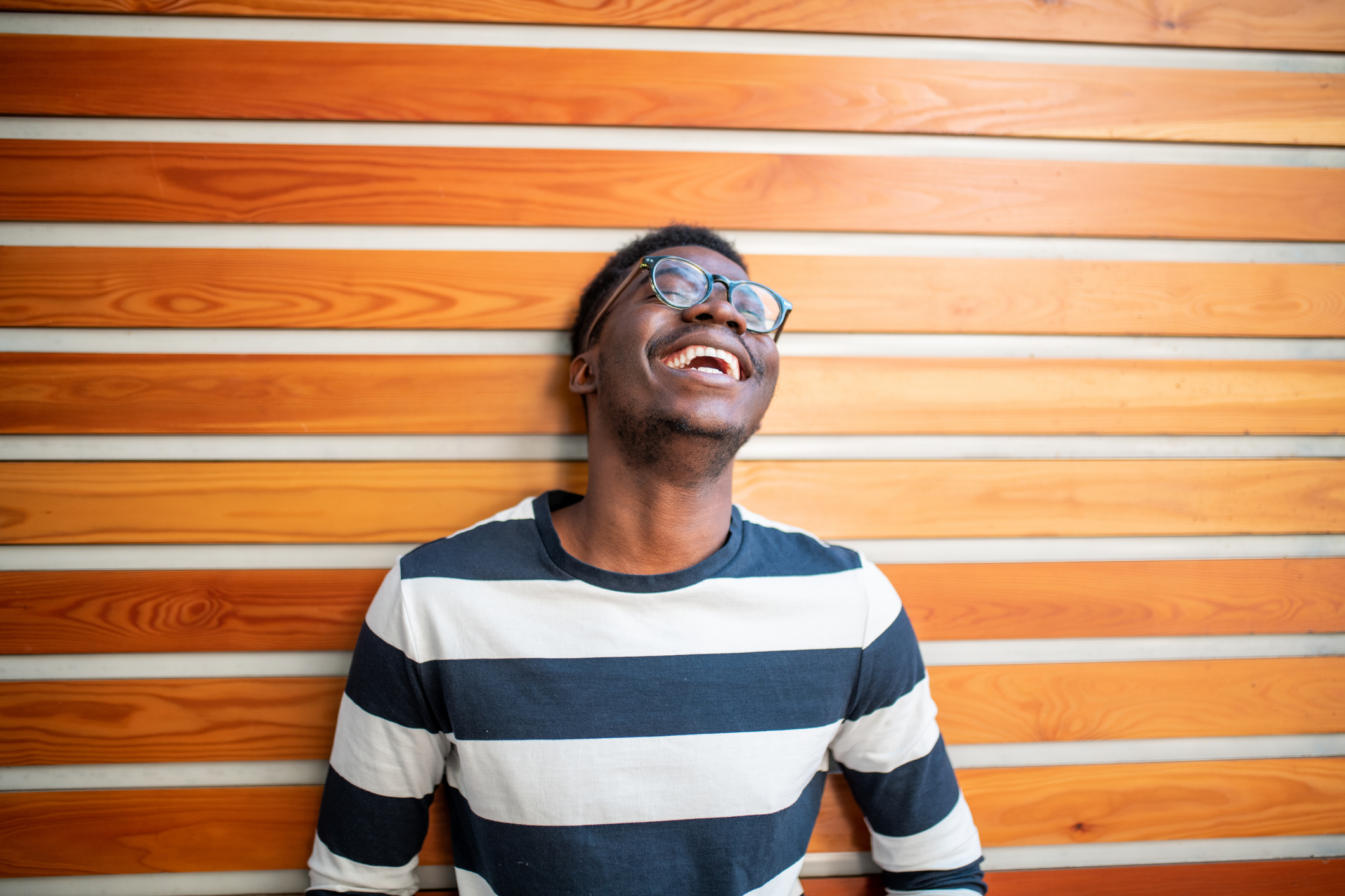 Young African man laughing.