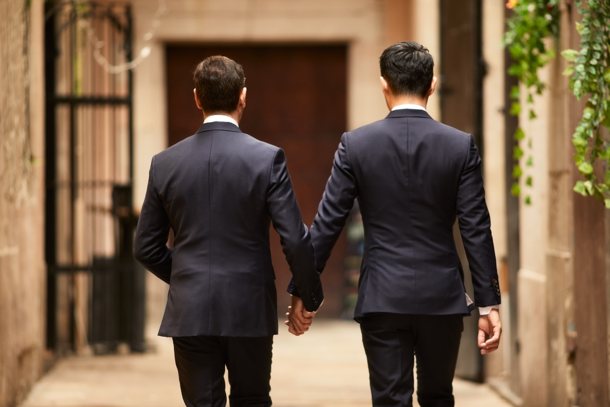 Gay couple engagement portraits.