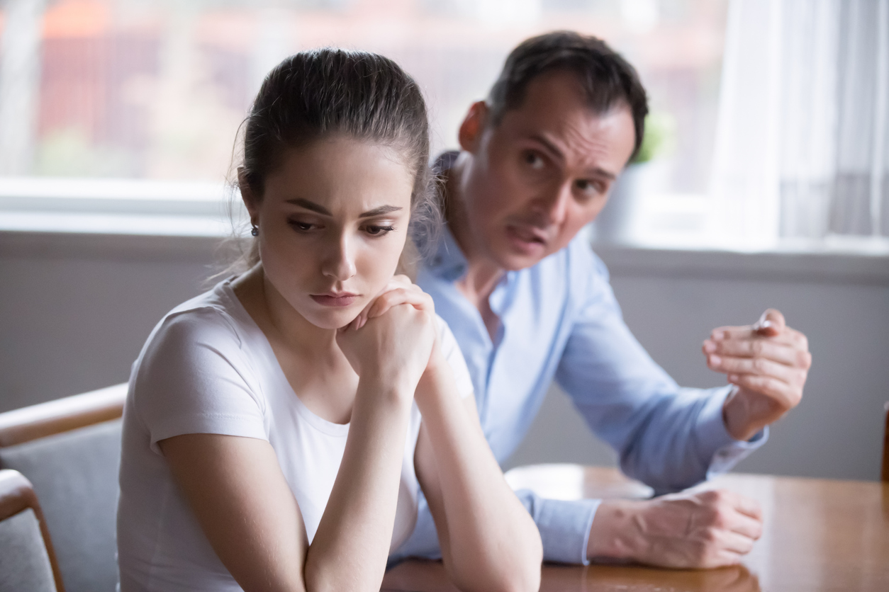 Upset millennial woman turn back on crying angry man