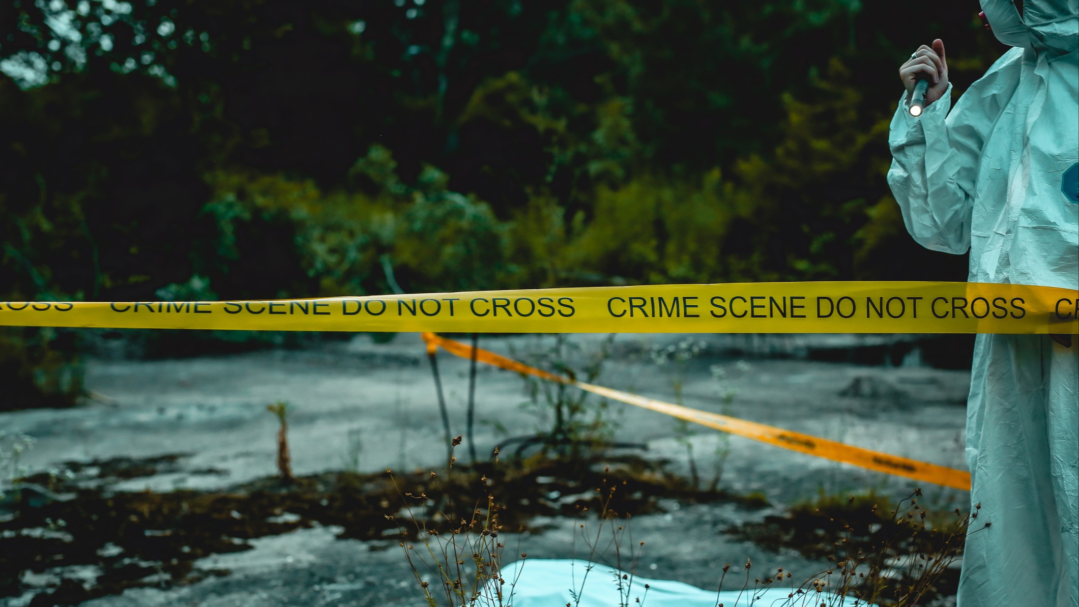 Forensic examines crime scene