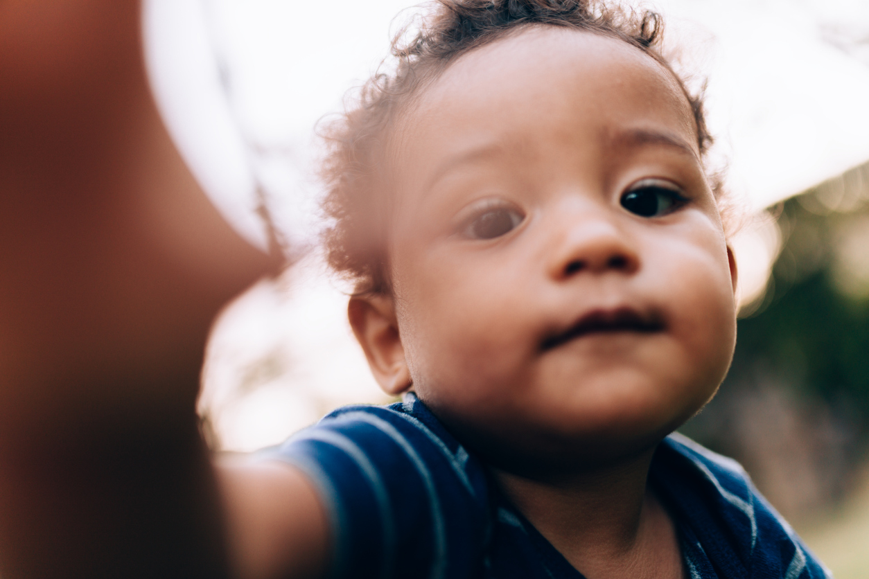 African descendant baby taking a selfie