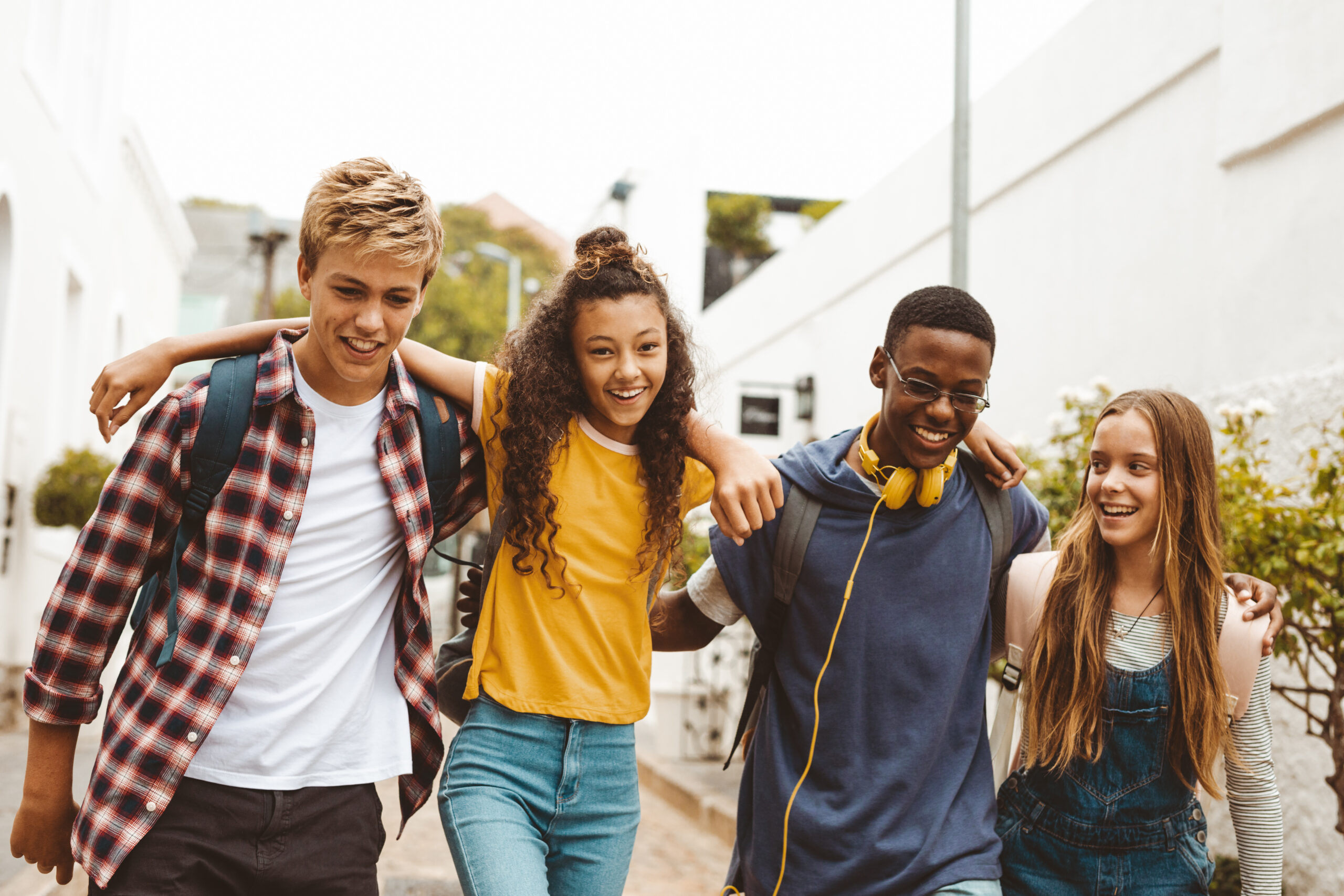 College friends walking in the street