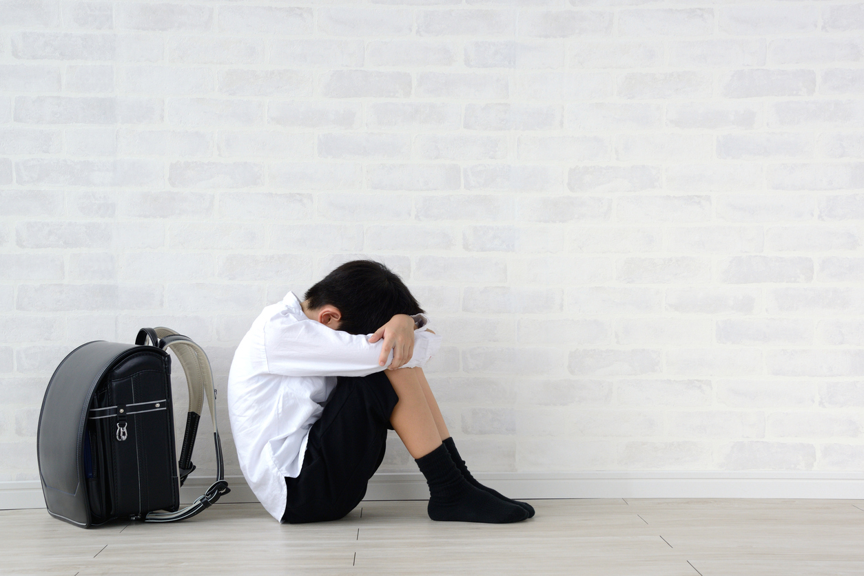 Child sitting alone in living room