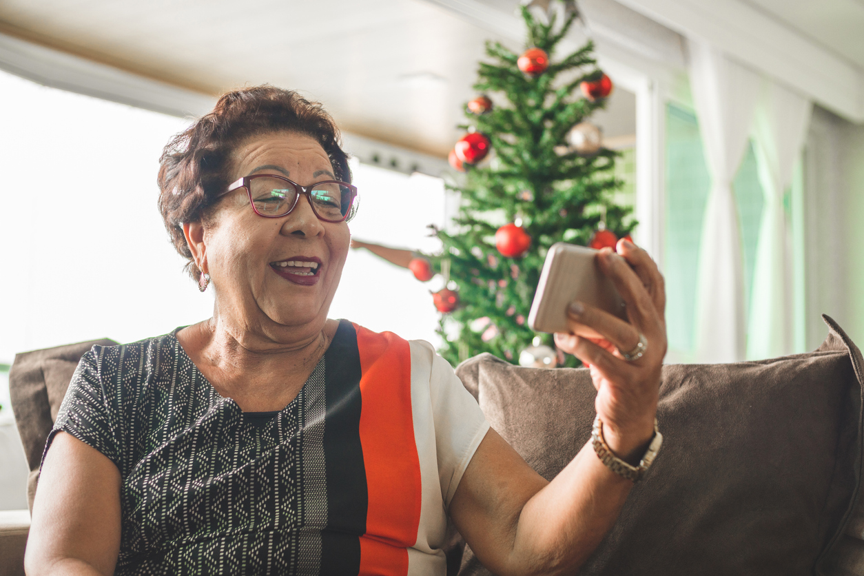 Grandma receiving christmas message by smart phone