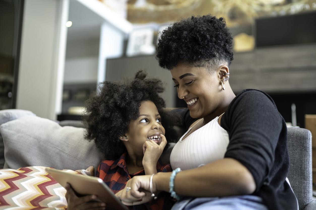 Sisters using a digital tablet