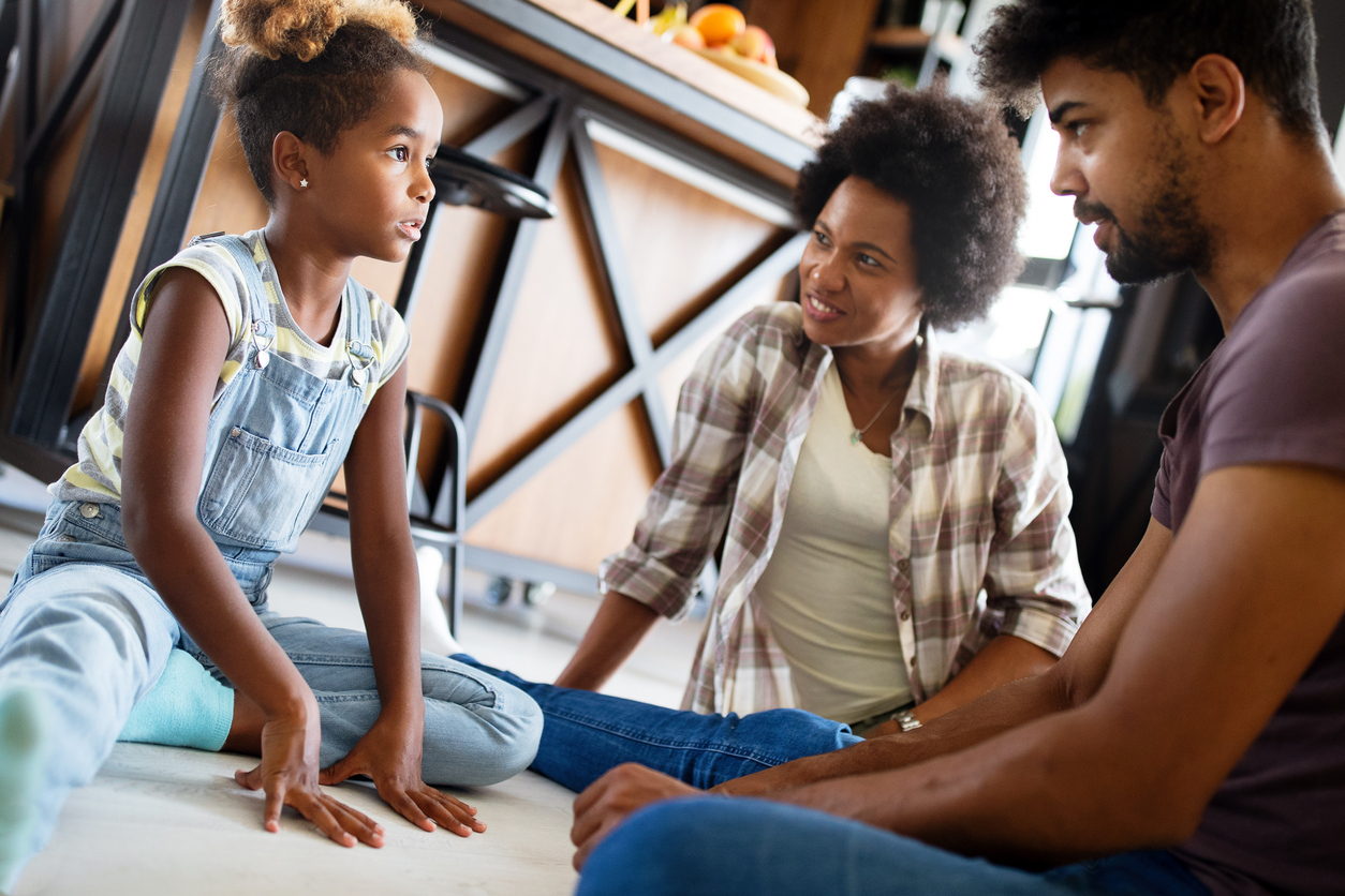 Parents having serious conversation with teenage child with problem solving attitude