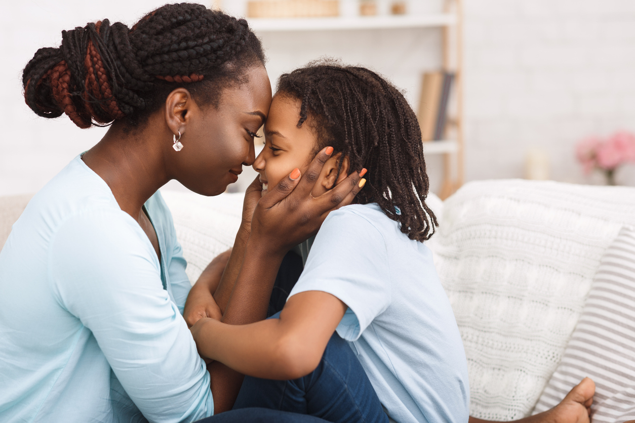 Loving african mom spending time with child