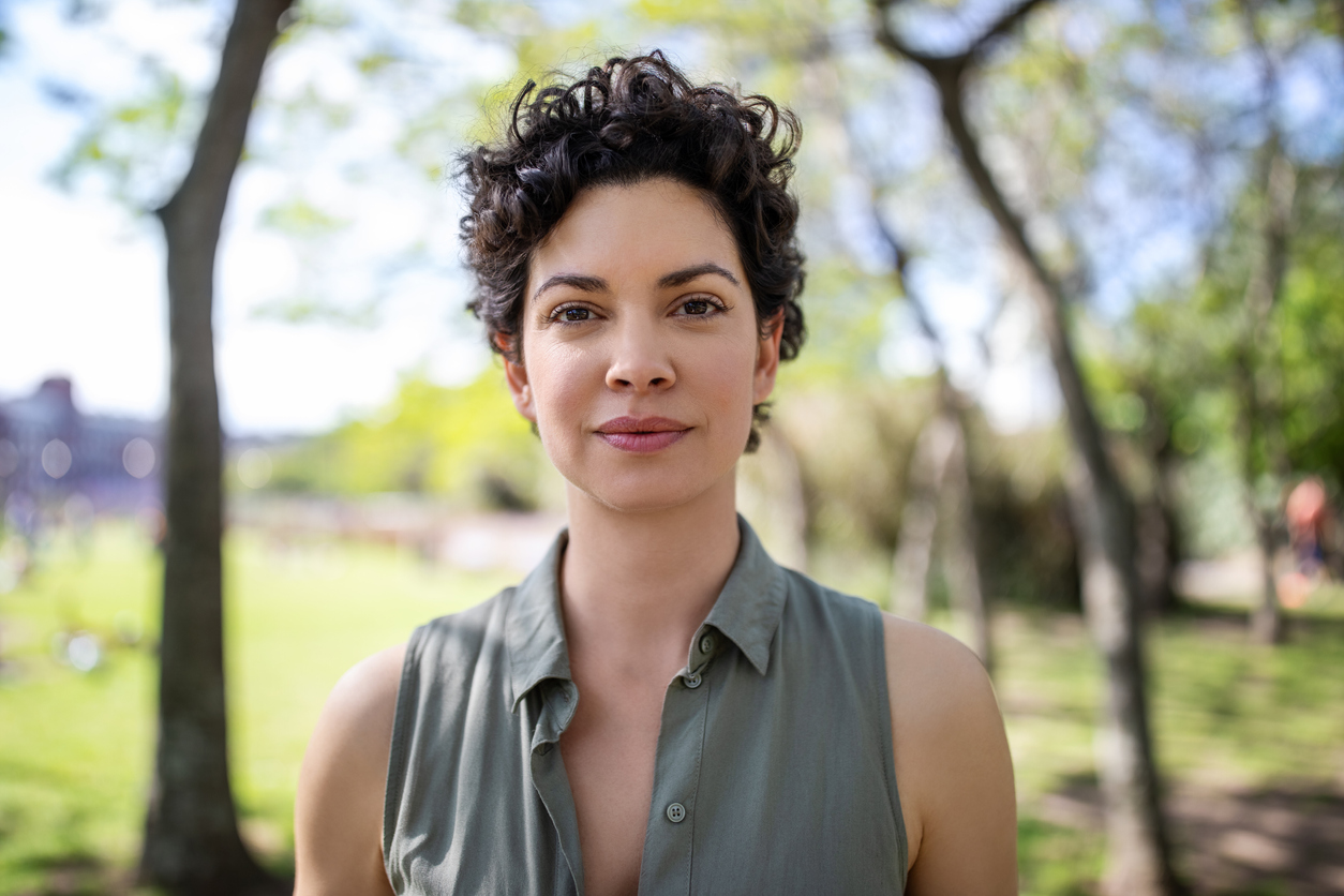 Portrait of a confident young woman at the park