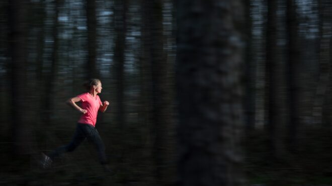 woman running in forest