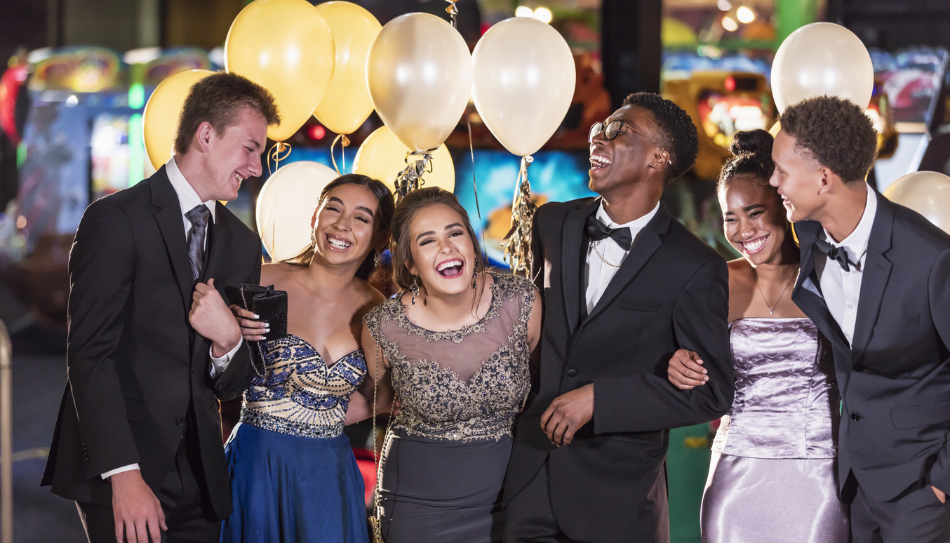 Group of multi-racial teenagers having fun at prom