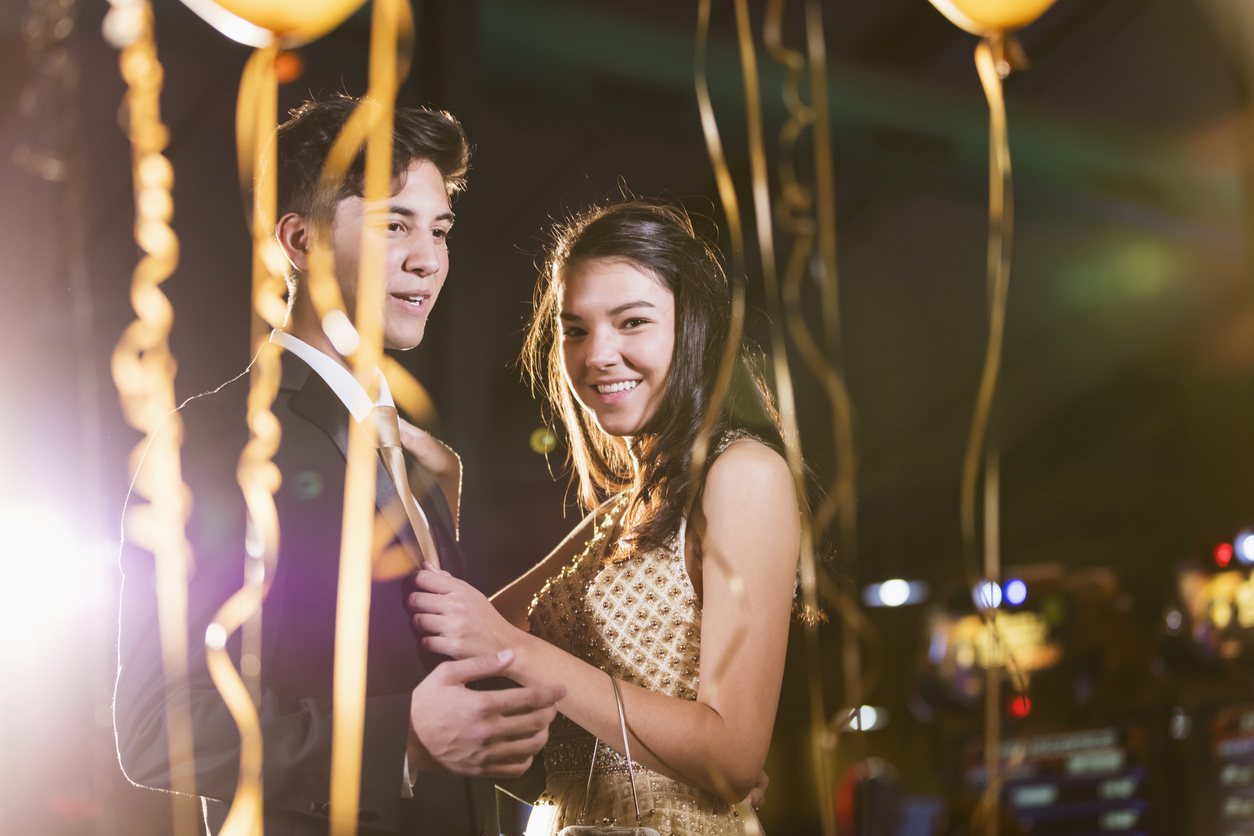 Teenage couple having fun at prom