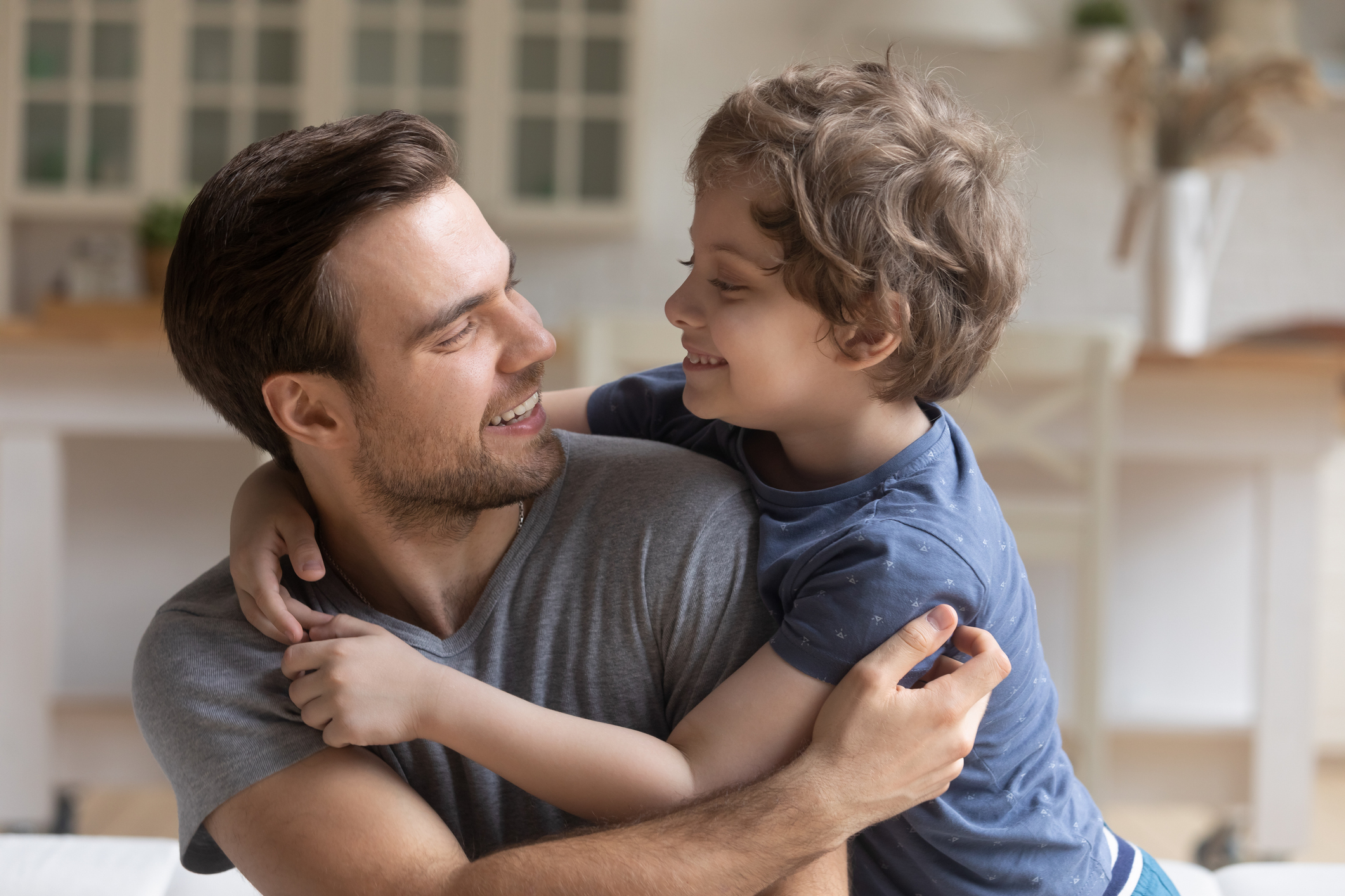 Father son having fun playing enjoy funny activities at home