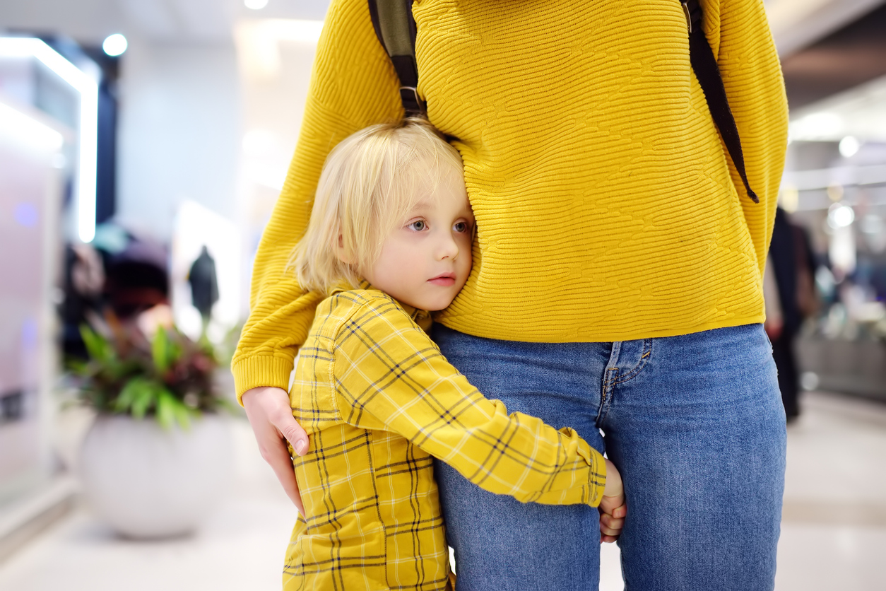 Little boy embrased his mother. Shyness, fears, anxiety.