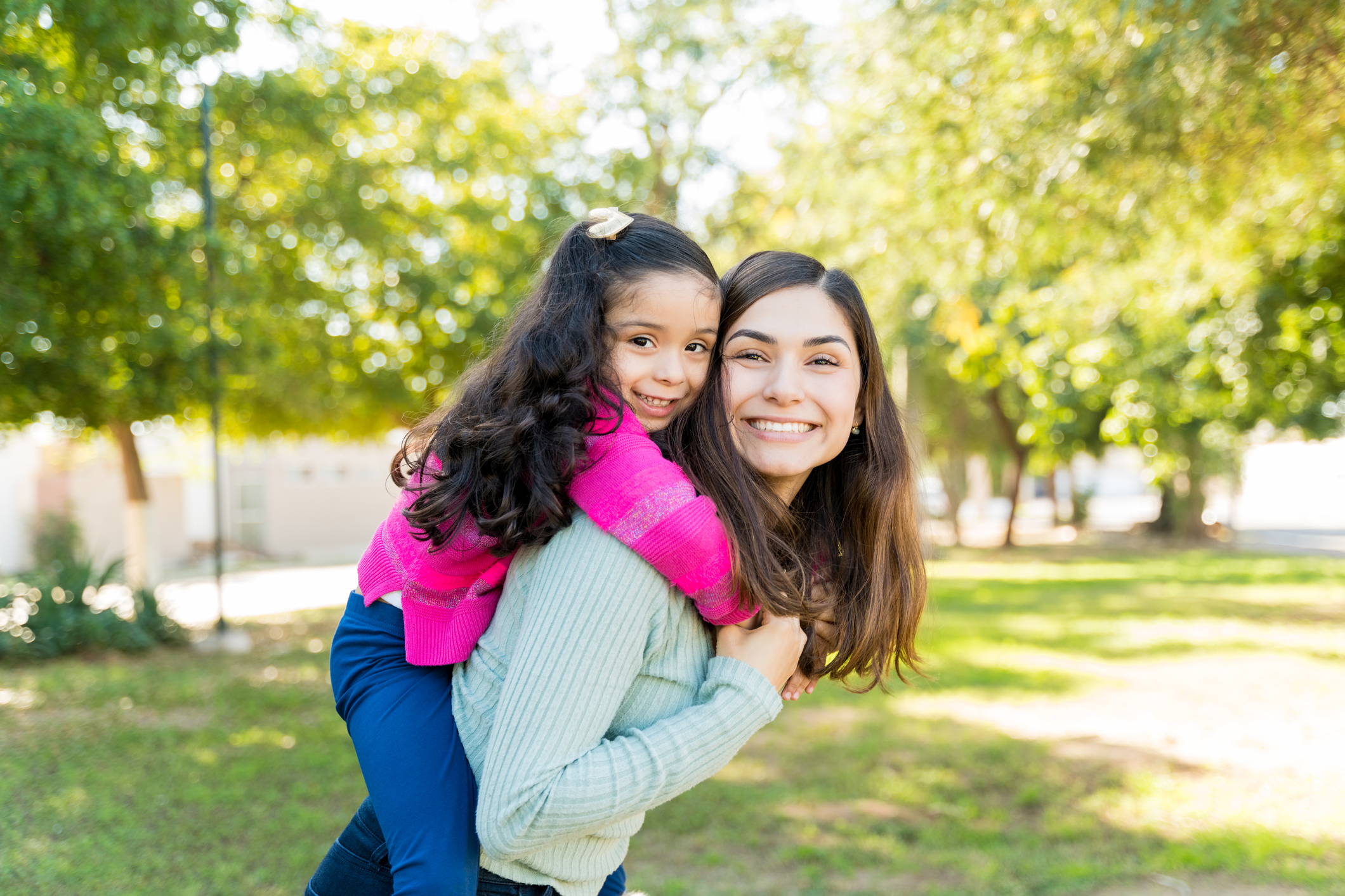 Playful Mother And Daughter Enjoying At Park