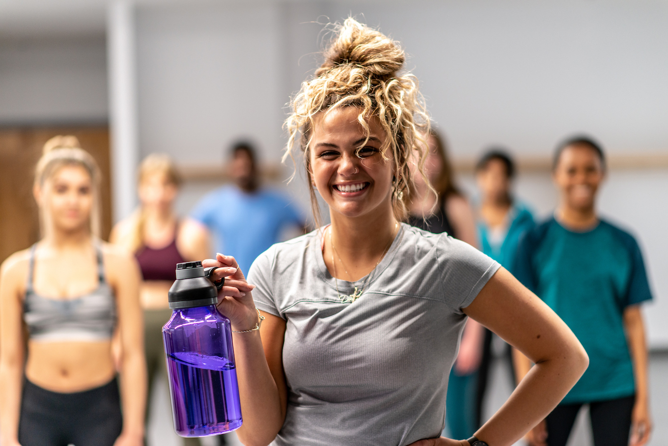 Multi-Ethnic Group of Young Adults in a Fitness Class stock photo