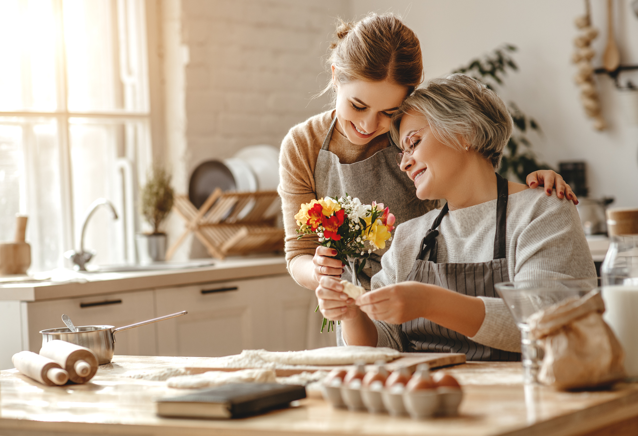 happy mother's day! family old grandmother  mother-in-law and daughter-in-law daughter congratulate on   holiday, give flowers