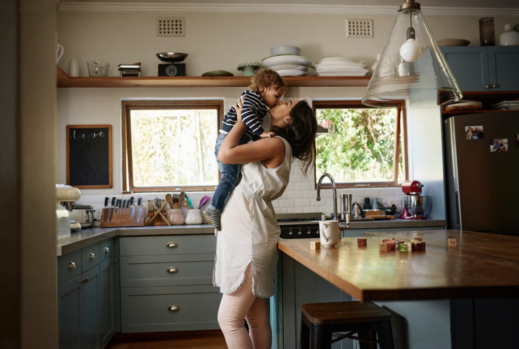 mom kissing child