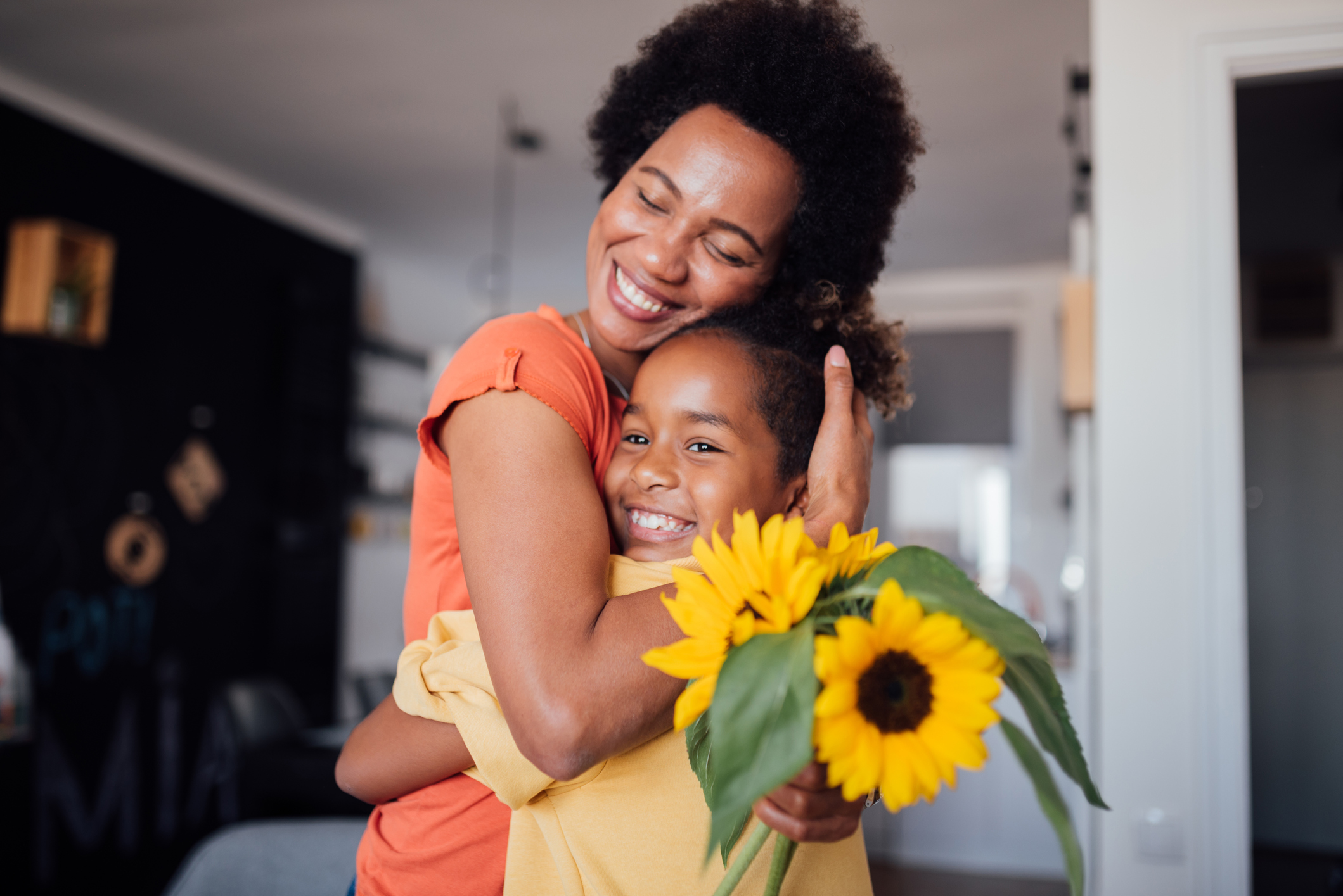 Beautiful little girl giving her mother a mother's day present