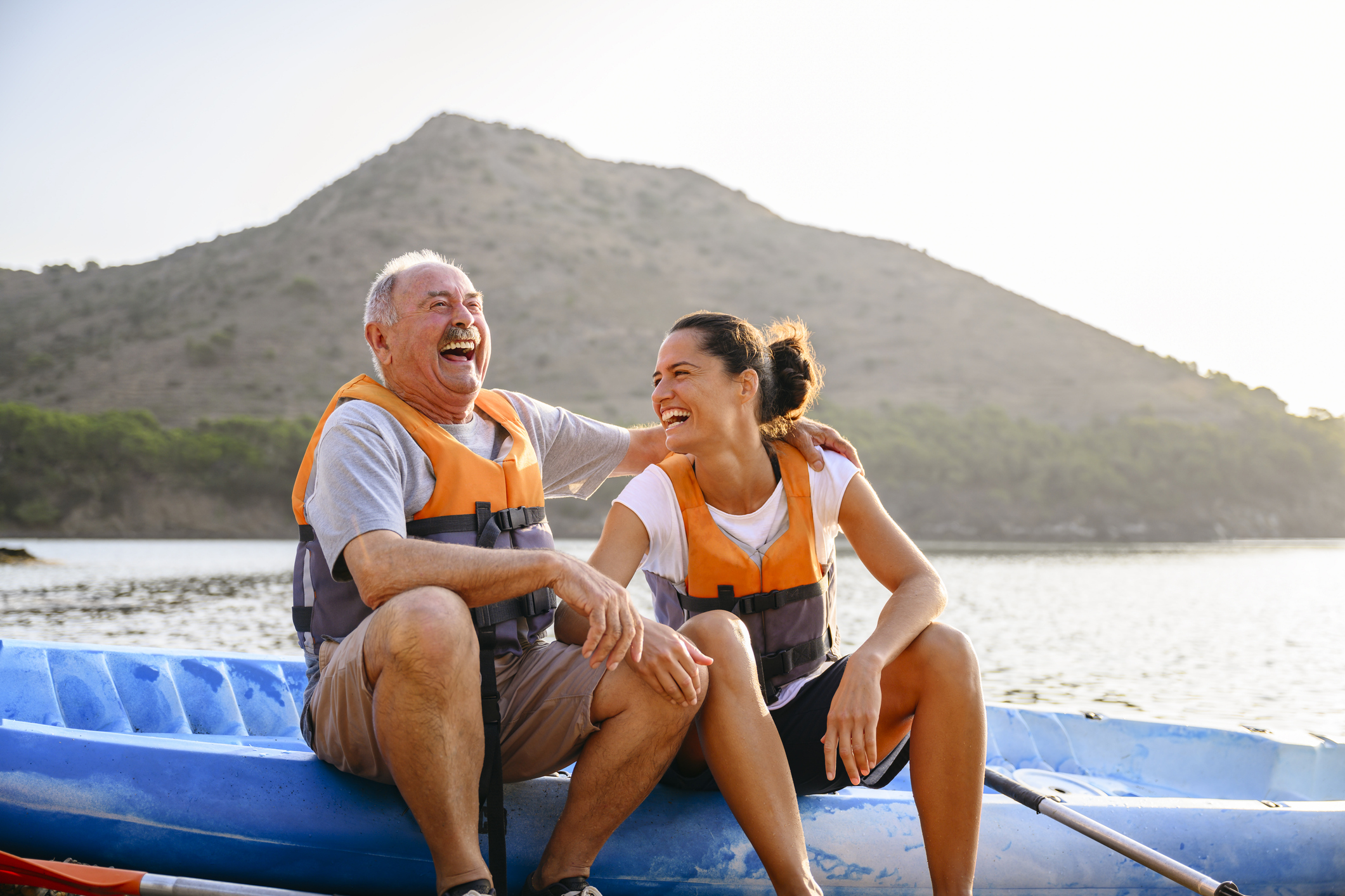 Spanish male and female enjoying early morning kayaking