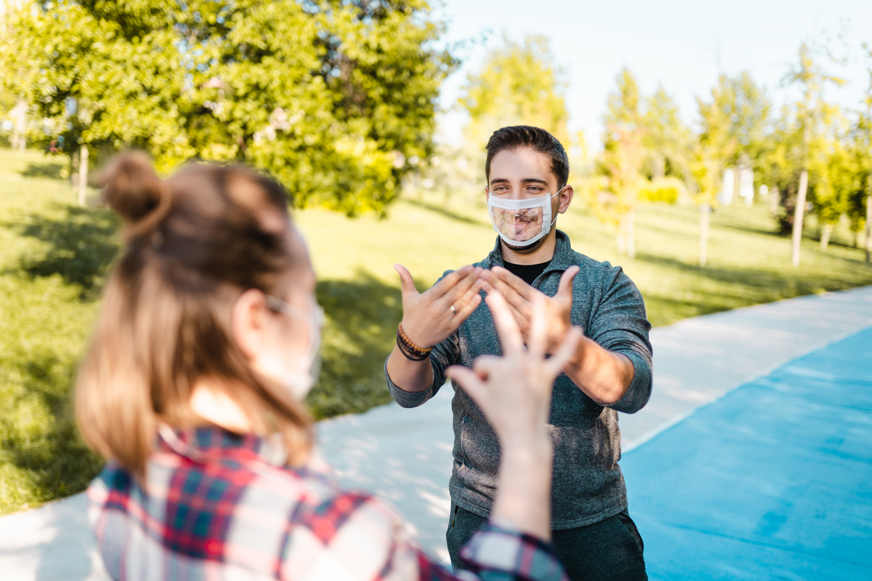 Deaf and hard hearing Young Adults wearing special face mask for lip-reading